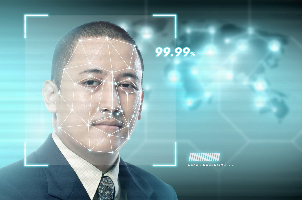 Handsome asian businessman using face recognition Ver-ID
